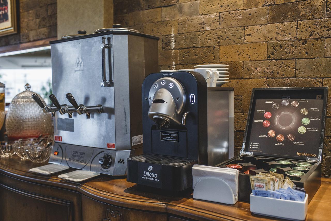 Golden Lis Hotel Boutique Goiânia Extérieur photo A single serve coffee machine
